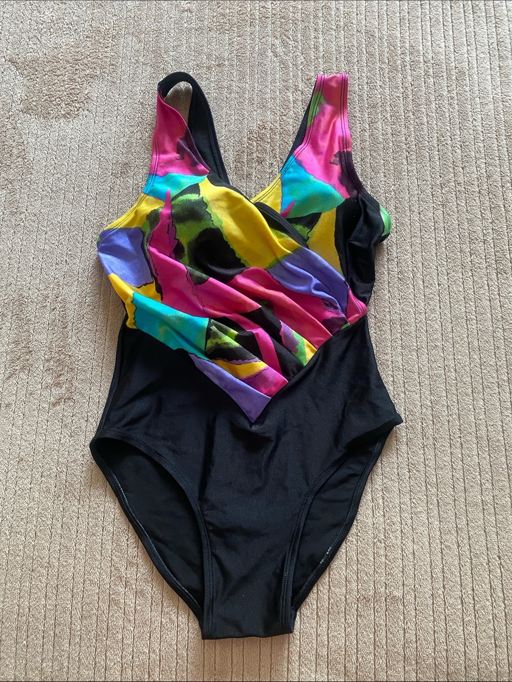 Black One-Piece Swimsuit with Bright Floral Colorblock. 

With removable cups.